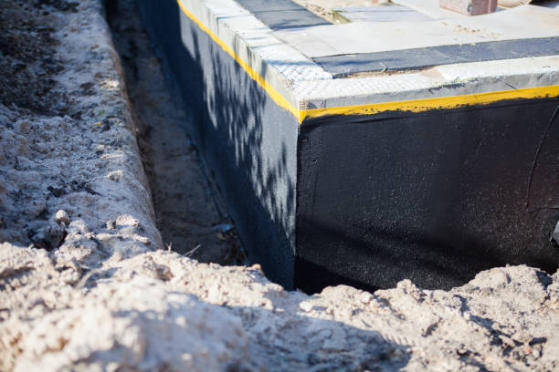 Professional Basement Waterproofing technician working in Milan, IL